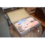 Suitcase inscribed 'KLD' containing doll parts