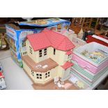 2 dolls houses and a qty of Sylvanian Families furniture and figures