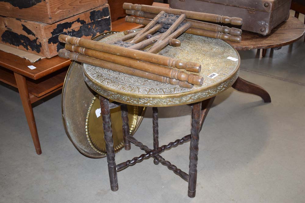 2 brass topped circular tables with folding legs and 3 brass trays