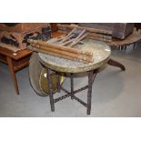 2 brass topped circular tables with folding legs and 3 brass trays