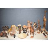 Tabletop with African drums, carved animal figures and masks