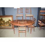 Oval teak extending table with 4 G-Plan teak framed ladderback chairs and multicoloured