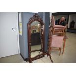 Large dark wood cheval mirror with shell and leaf carving