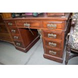 Oak knee-hole desk with brown leather insert