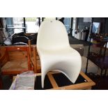 Cream plastic moulded chair