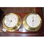 Clock and barometer on a single oak panel