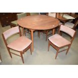 Circular drop leaf teak table with 4 Scandart teak framed chairs with pink upholstery *Collector's