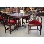 Circular darkwood table plus 4 shield back carver chairs