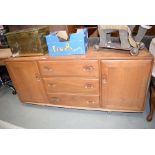 Ercol sideboard with three central drawers