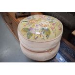 Pink fabric and embroidered pouffe