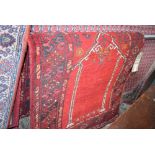 12 Afghan mat with red background