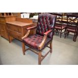 Red leather effect Chesterfield style armchair