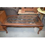 Heavily carved and brass inlaid Indian coffee table