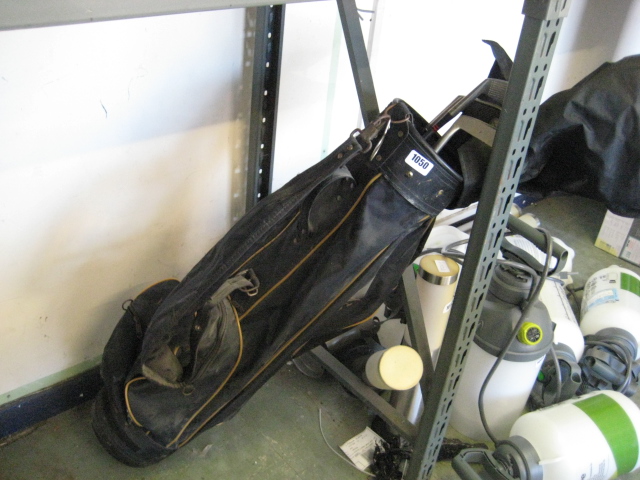 Golf bag containing golf clubs