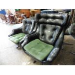 2 black upholstered vintage swivel chairs *Collector's Item: Sold in accordance with our Soft