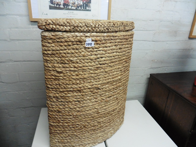 Woven corner laundry basket