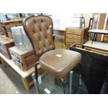 (2169) Vintage metal and faux leather button back chair *Collector's Item: Sold in accordance with