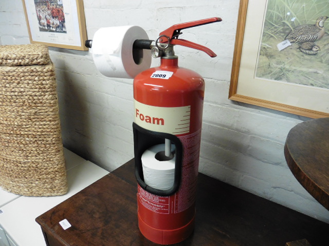 Fire extinguisher converted to toilet roll holder