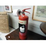 Fire extinguisher converted to toilet roll holder