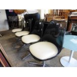 Set of 4 moulded plastic and chrome swivel chairs *Collector's Item: Sold in accordance with our