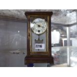 Decorative brass and glass mantle clock