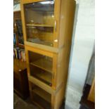 Light oak 3 door glass fronted cupboard