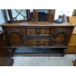 Dark oak sideboard with 2 central drawers and cupboards