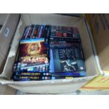 3 boxes of various DVDs