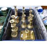 Crate of various brass candlesticks