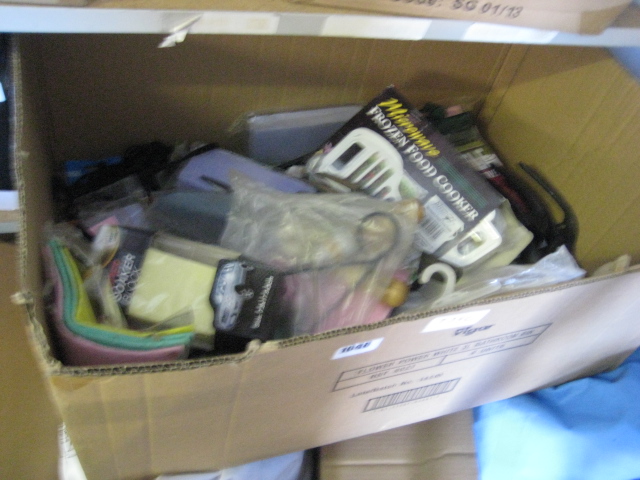 Box containing gardening trowels, towels, etc.