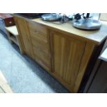 Modern light oak sideboard with 3 central drawers flanked by 2 cupboards