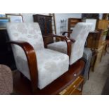 Pair of floral upholstered easy chairs with bent wood arms