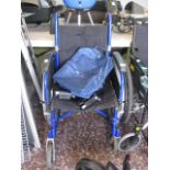 Foldable blue wheelchair