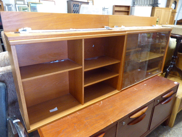 Pair of modules for mid century teak wall unit system, 1 having glazed sliding doors and 1 open