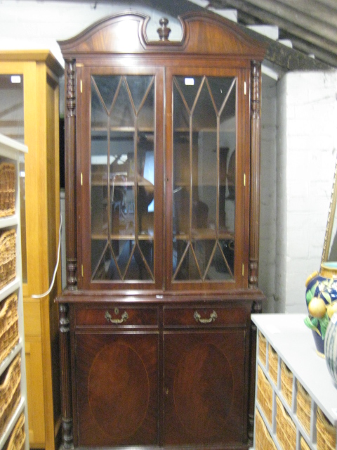 (2014) Mahogany cabinet with glazed shelves over pair of drawers and cupboards