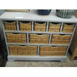 Grey multi compartment cabinet with wicker basket drawers