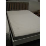 White wooden double bed frame with Hafslo IKEA double mattress