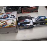 7 boxed remote control vehicles incl. Dune Tracker, Mini Cooper, Vision GT, 3x helicopters and