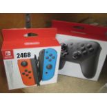 Boxed Nintendo Switch Pro controller with boxed pair of joy con controllers