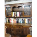 (2004) Oak dresser with central drawers flanked by cupboards with glazed and open shelves above