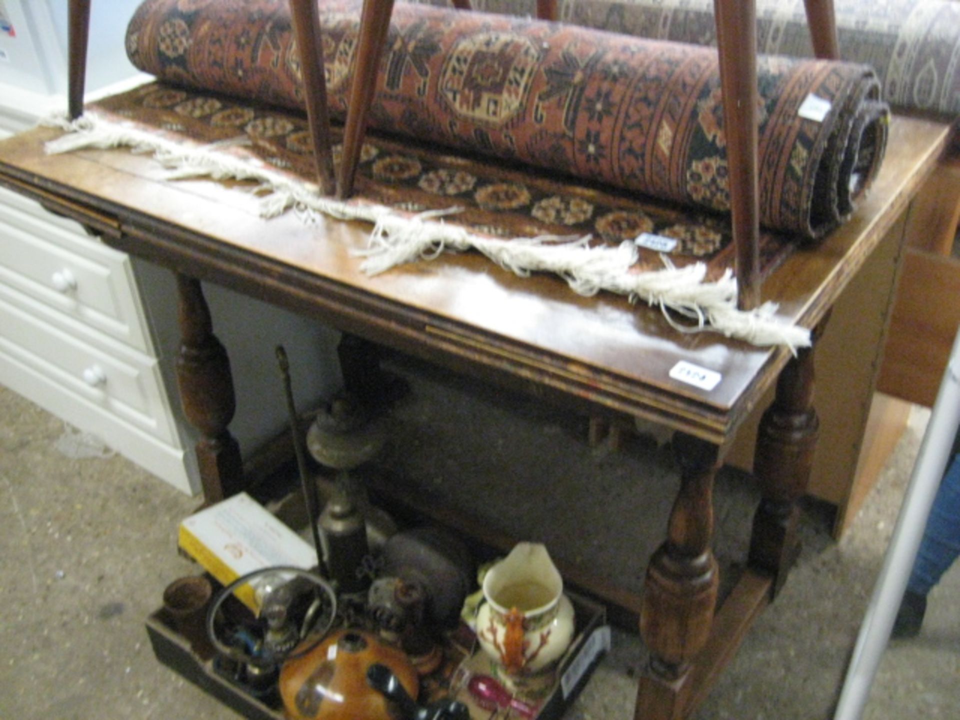 Oak extending dining table with spindle back chairs