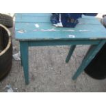 Small green wooden planting table