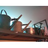 4 vintage watering cans with Bitburger pot
