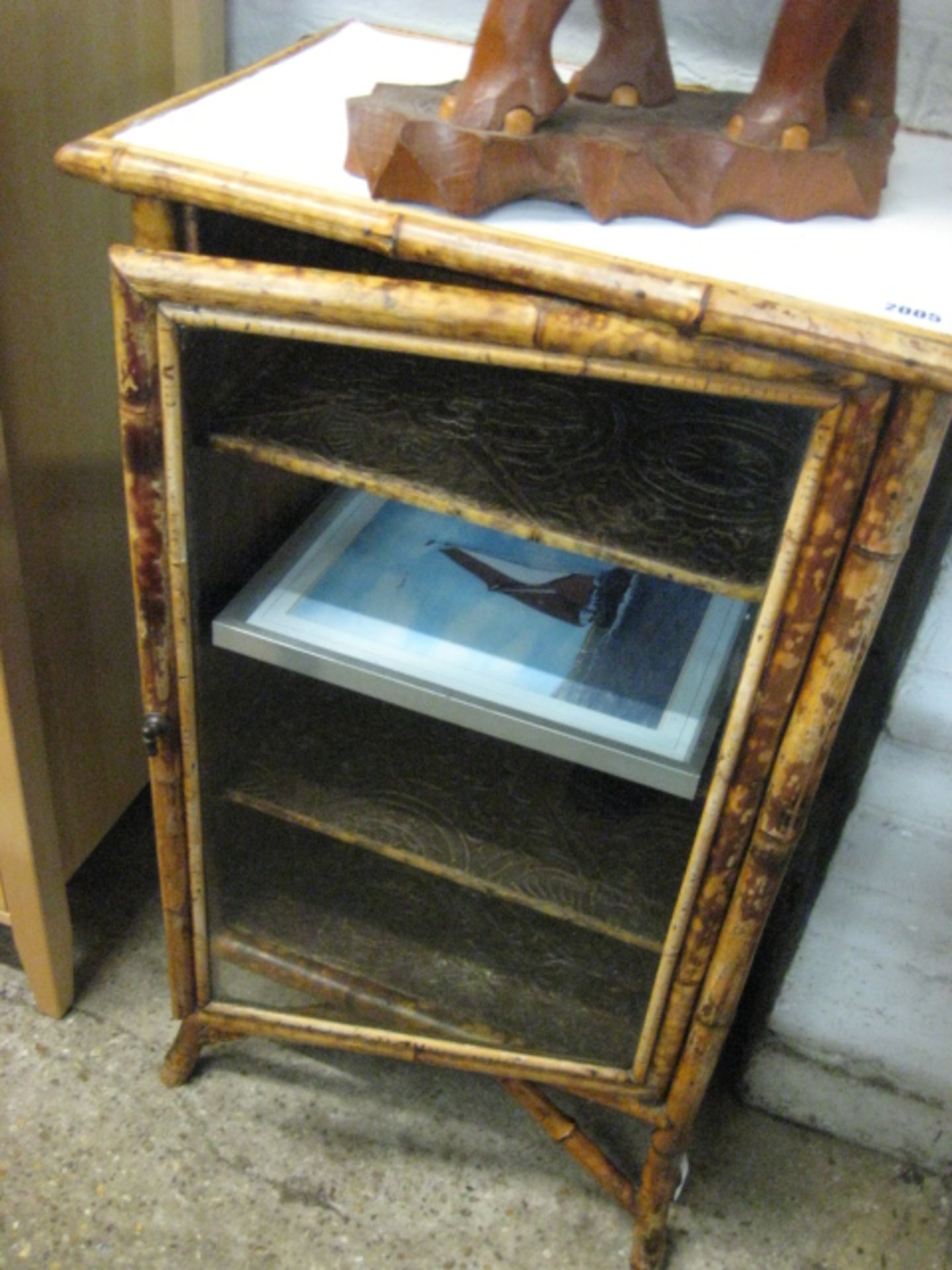 Bamboo and glazed cabinet with framed picture of sailing ship
