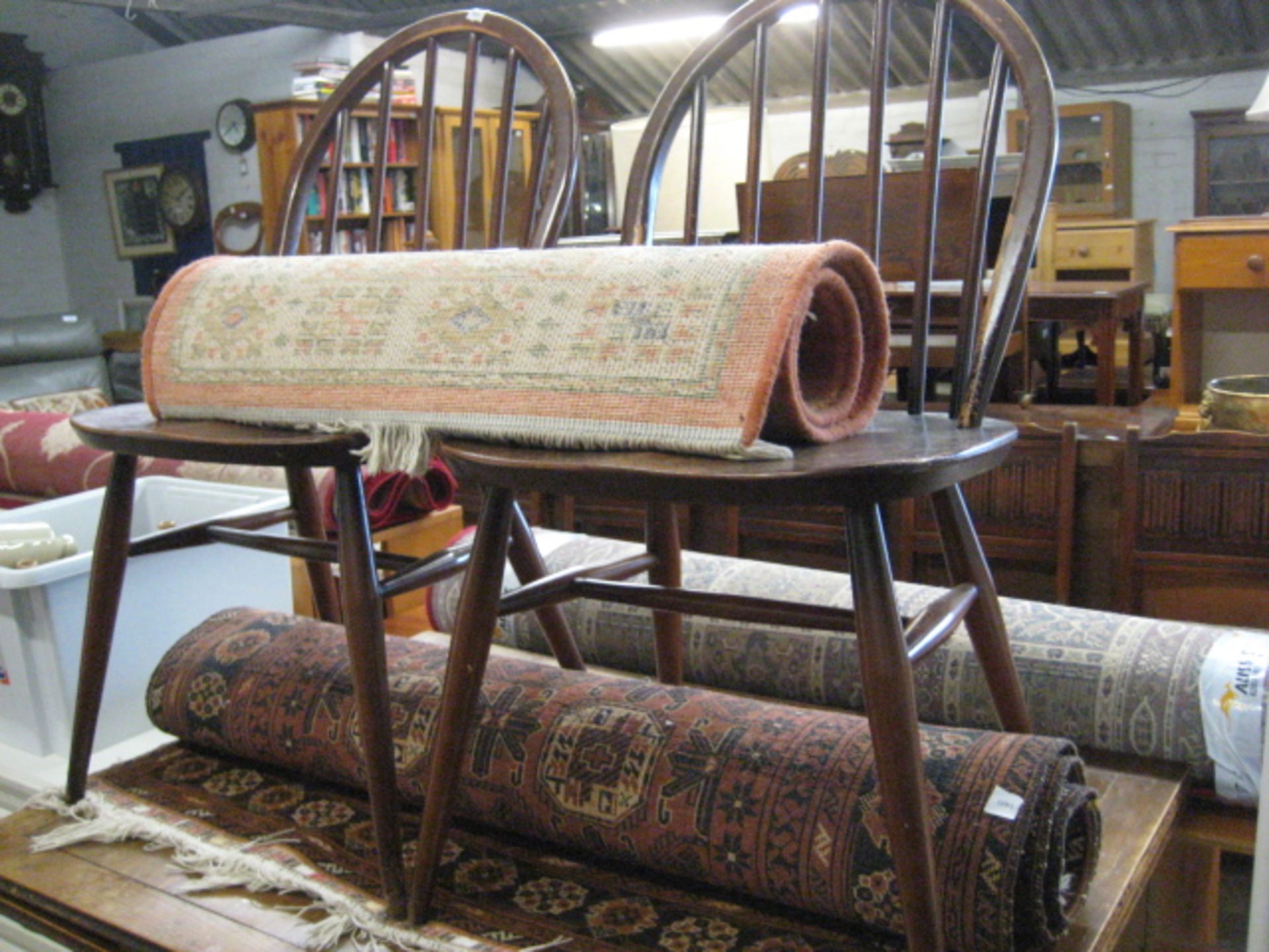 Brown ground rug and smaller orange ground rug