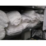Shelf containing medium white spa towels