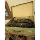 Case containing brassware incl. horse brasses and swingers