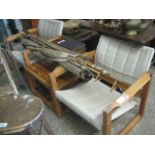 Pair of pine framed safari type easy chairs and matching coffee table