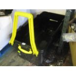 Black and yellow wheel able storage container