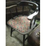 Captain's style oak and upholstered spindle back chair